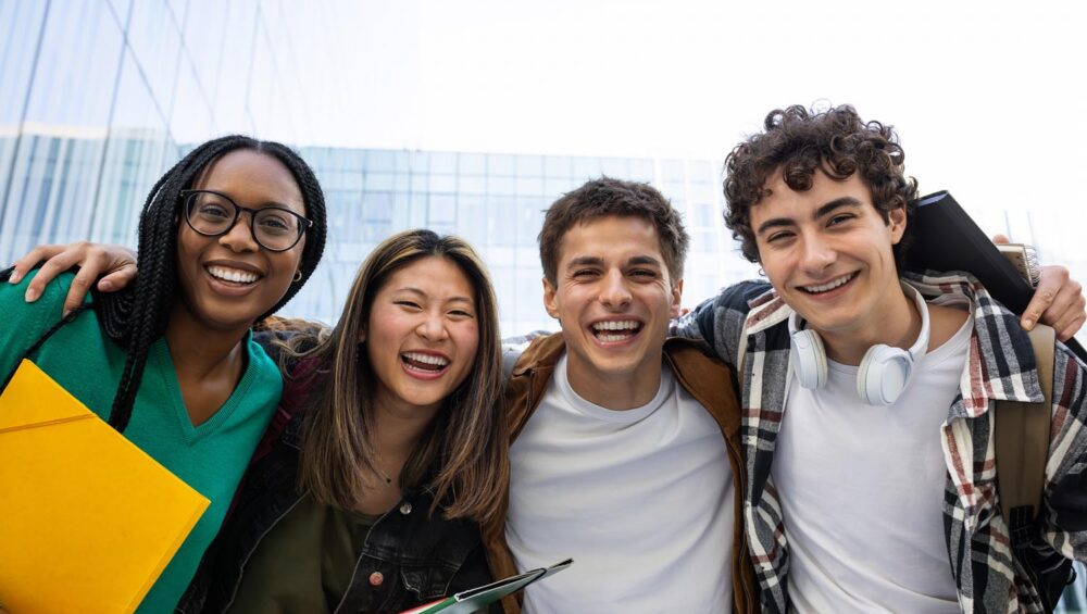 Happy college students laughing and having fun