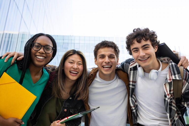 Happy college students laughing and having fun